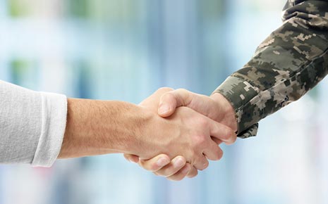 veteran and civilian shake hands