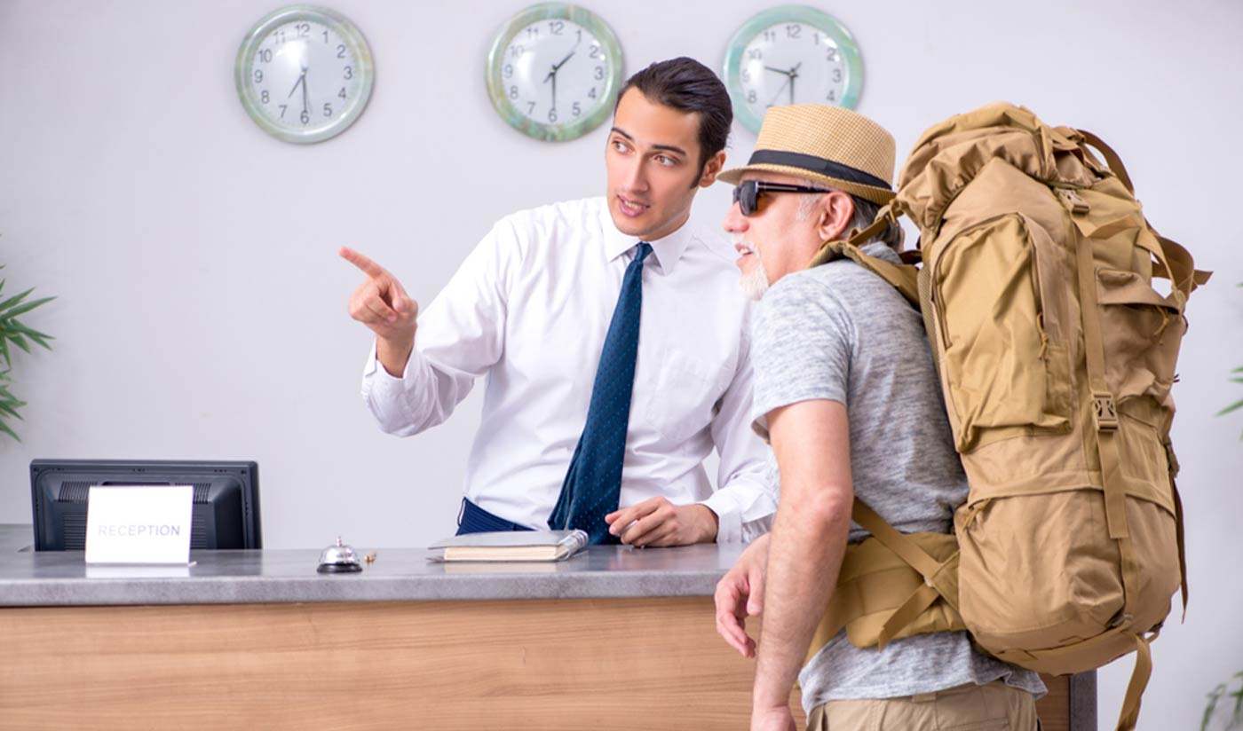 backpacker at reception desk