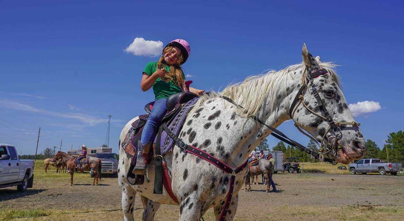 smiling girl on horse