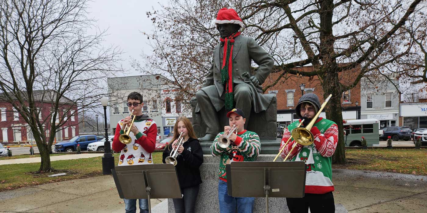 local young musicians performing holiday music in the park