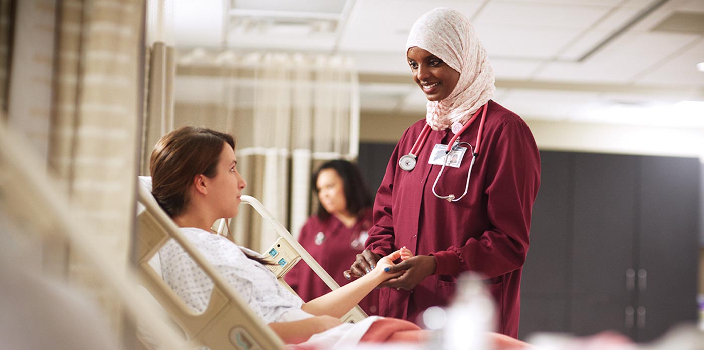 somali hospital nurse helping a patient