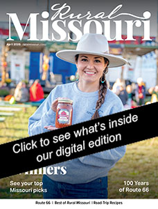 Woman holding jar of apple butter during Mount Vernon's Apple Butter Makin' Days.