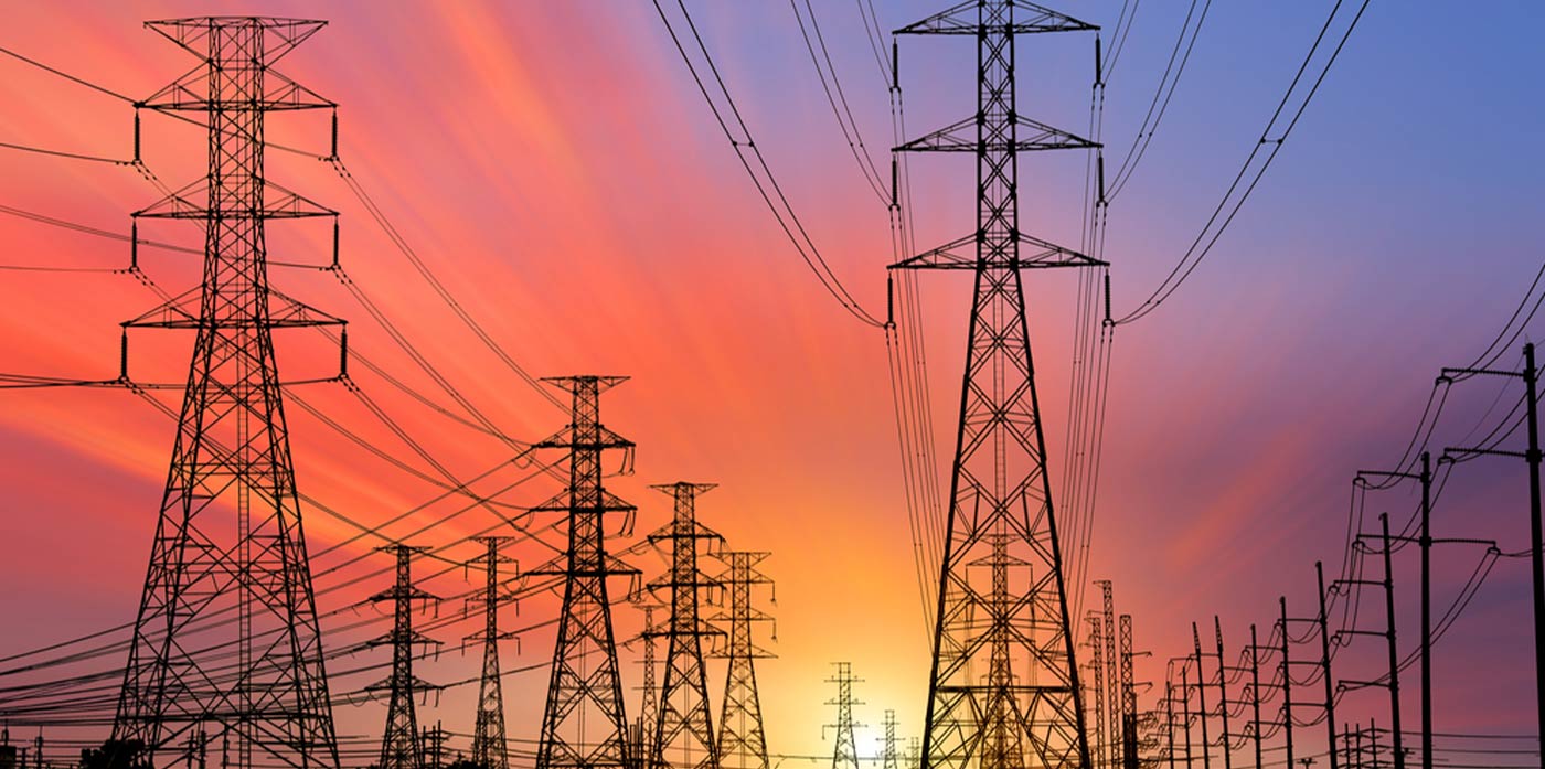 power lines silhouetted against sunset