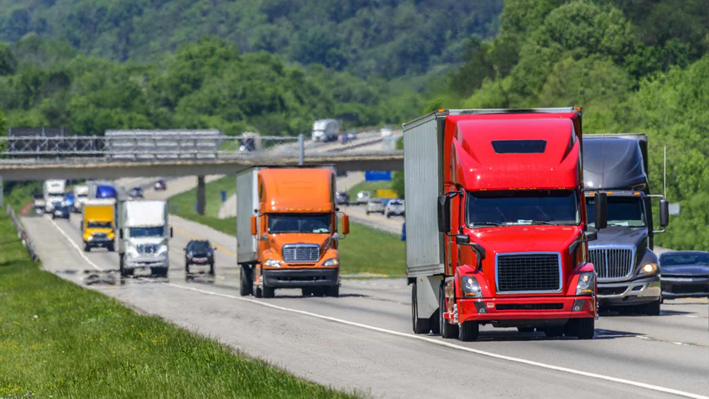 interstate highway in TN with many semi tractor trailers driving