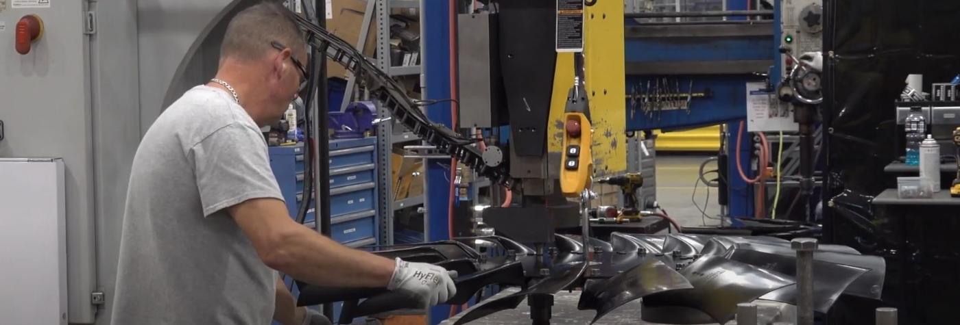 person preparing automotive parts