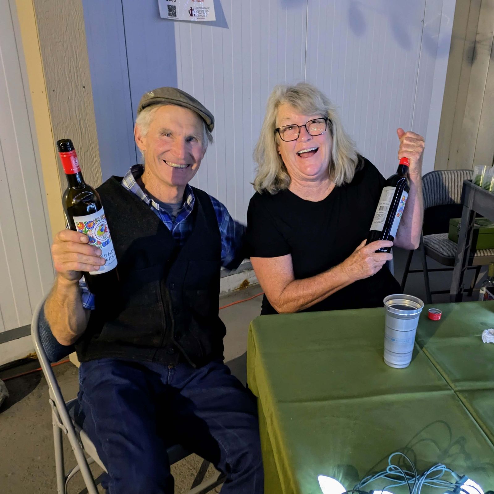 People gathered around tables enjoying the Farm to Table dinner