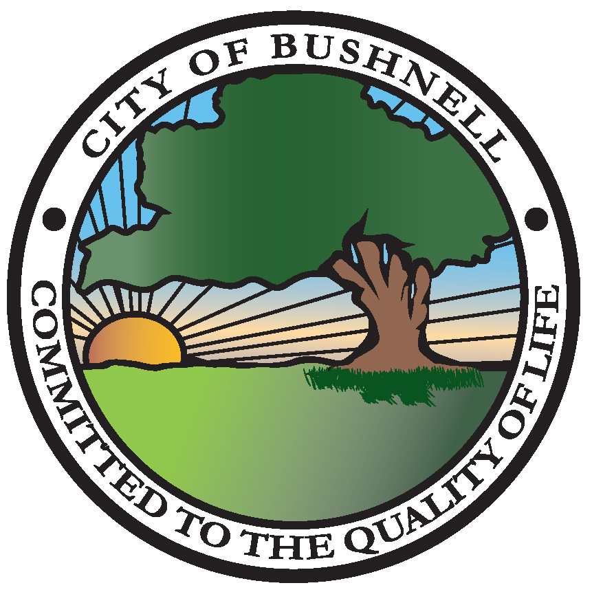 City of Bushnell logo, art with a sunrise over a tree.