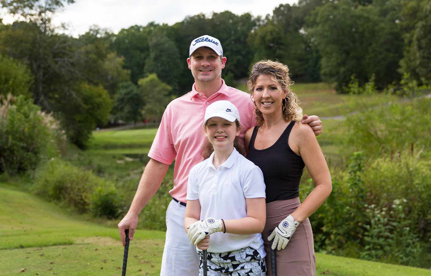 dad, mom, daughter at mouse creek golf course