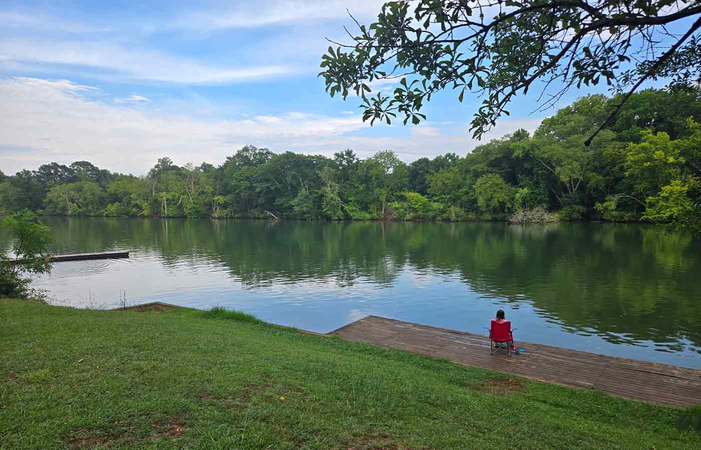 dock and person enjoying the hiwassee river
