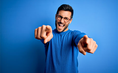 Guy enthusiastically pointing at the camera