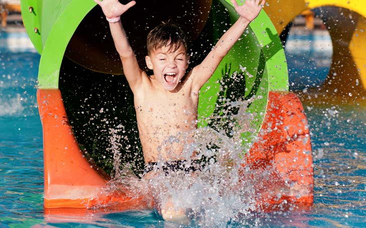 child on waterpark slide
