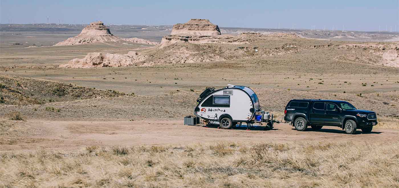 SUV and camping trailer in the desert