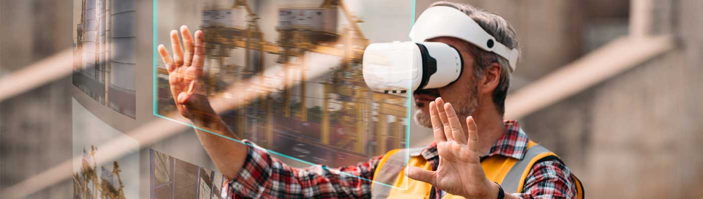 A senior engineering using virtual reality to construct a project.