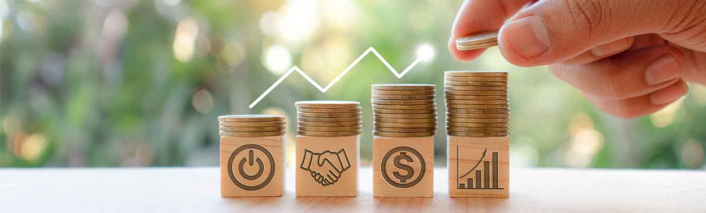 investment coins stacked on blocks