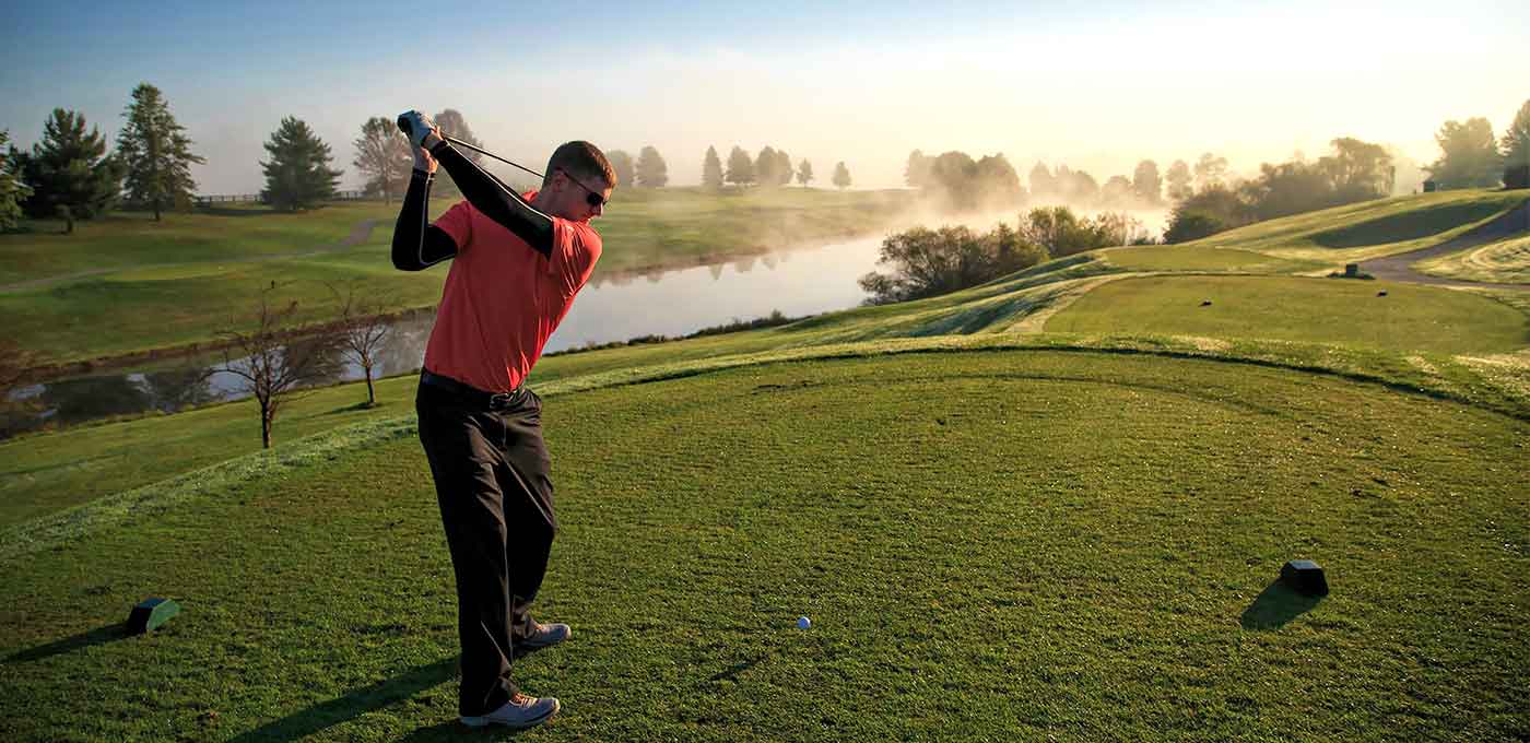 man teeing off at a golf course in richmond, ky