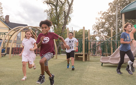 Children running and enjoying a park at Lake Reba, located in Richmond, KY