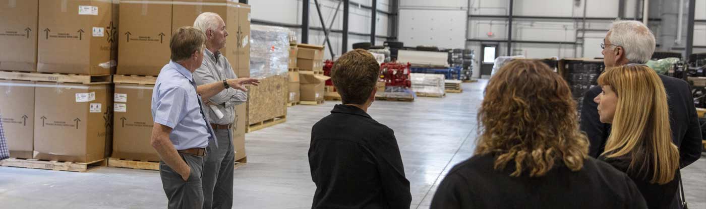 Board members of the Clinton County Industrial Development Agency (CCIDA) touring a local business building.