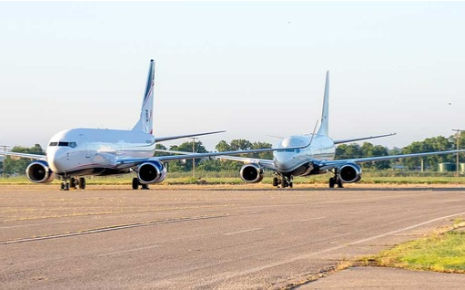 Two airplanes on an Ardmore runway
