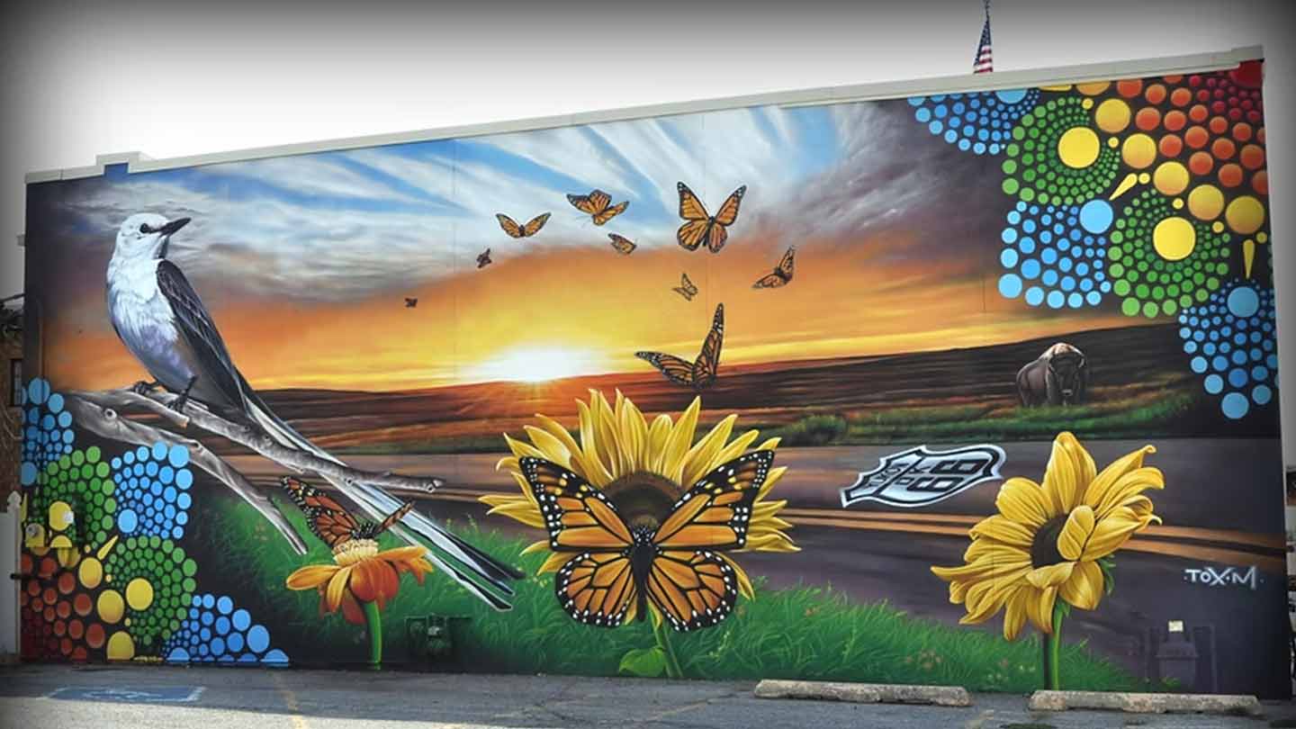 yukon sunset mural main street banner