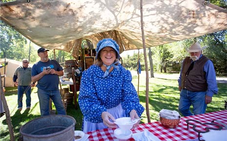 Woman preparing for a picnic outside at Chisholm Trail Festival in Yukon, OK