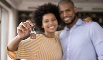 Husband and wife, new homeowners, tenants excited with house buying,