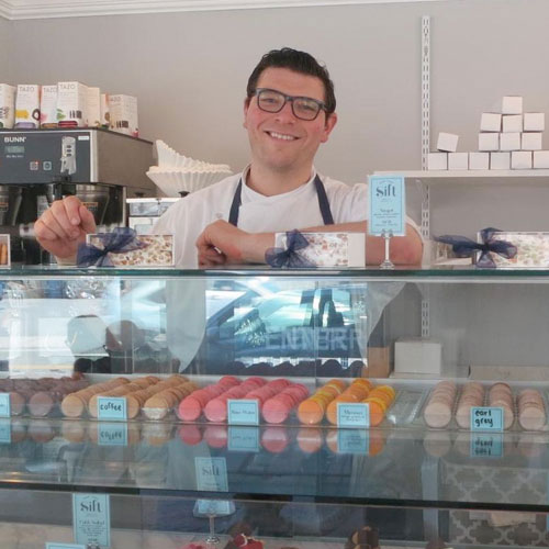 friendly server at a food counter