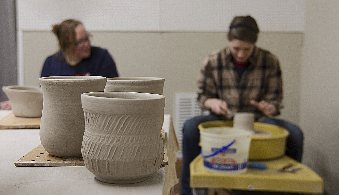 potter throwing on the wheel