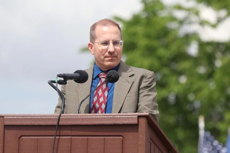 Retired Col. Joshua Simer speaks May 26 during a Memorial Day ceremony at the Minnesota State Veteran's Cemetery in Little Falls. by Jeff Hage / Morrison County Record