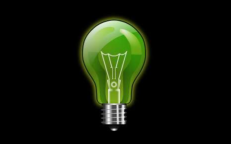 The image is a classic digital illustration of a glowing green light bulb against a black background.