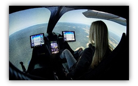 The image appears to show a pilot inside the Beta Technologies ALIA electric aircraft simulator.