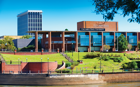 The image shows the Riverside Theatre Complex at Columbus State University's RiverPark campus along the Chattahoochee River in Columbus, Georgia.