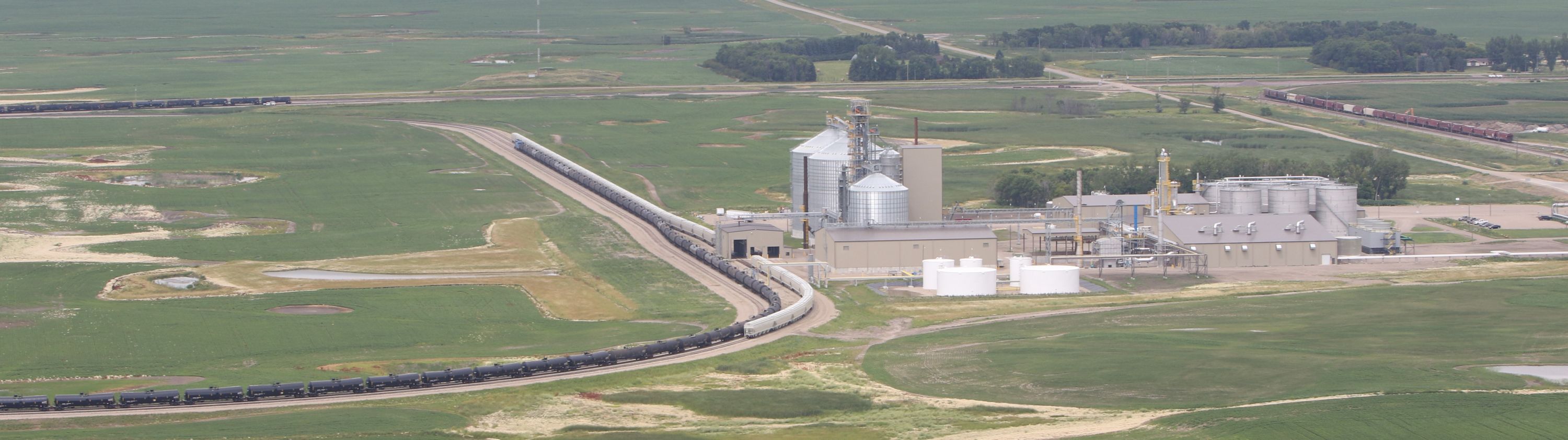aerial view of grain elevators and trains
