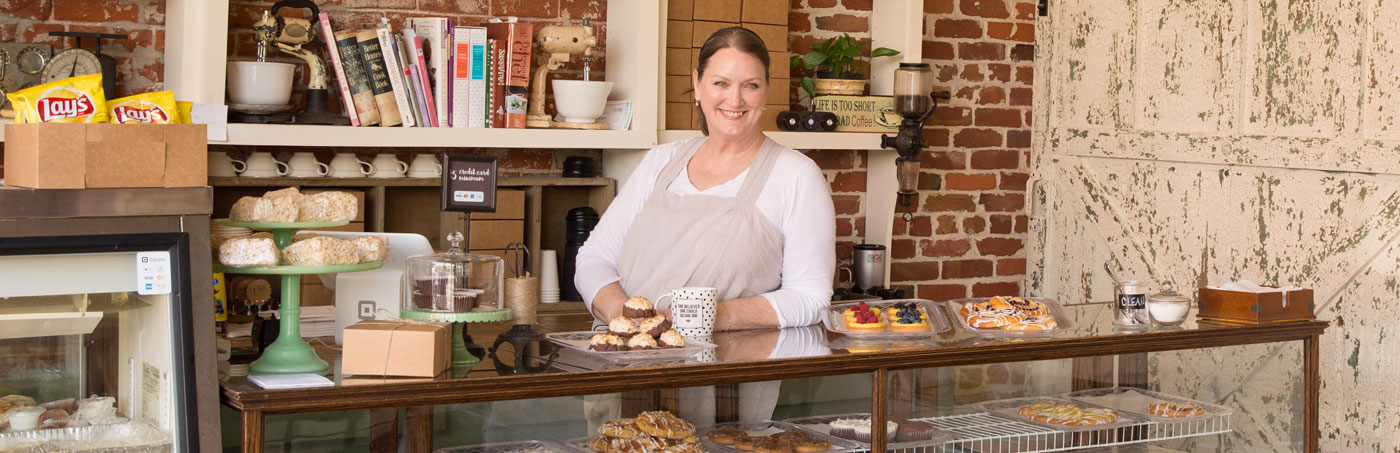smiling woman in a bakery