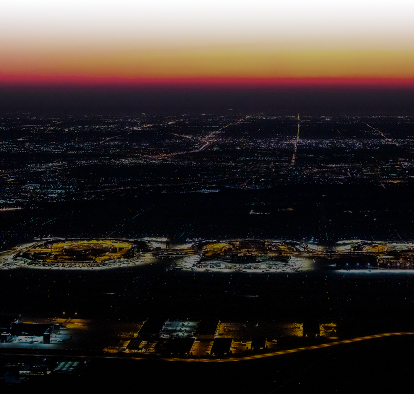 Aerial shot of Grapevines location in Texas at dusk. You can see the lights of the community lit up.